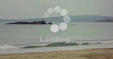 Loading animation over beach scene with waves and distant island 스톡 동영상 304481074