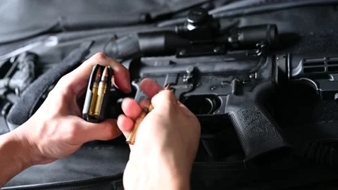 Loading an AR 15 magazine Stock Footage 146619980