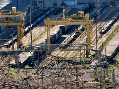 Loading Area With Cranes And Wagons, Large Industrial Site With Rail Equipment Stock Photos