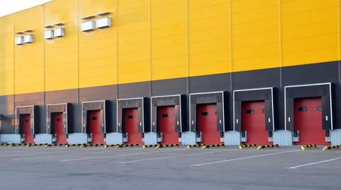 Loading area with roller shutter gates of a large distribution warehouse. Stock Photos