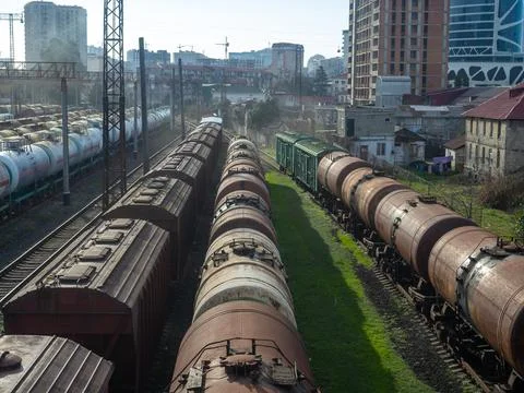 Loading area of the station. Lots of freight trains. Wagons - tanks on rail.. Stock Photos