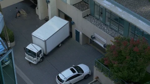 Loading area from top point of view. White pickup track and car. 스톡 동영상 73910795