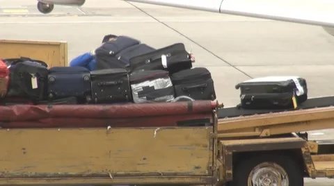Loading Baggage Onto Plane Stock Footage 1128873