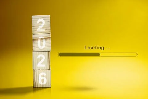 Loading bar with a stack of wooden cubes with the number 2026 on a white ba.. 写真素材