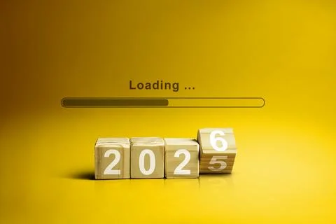 Loading bar with wooden cubes transform from the number 2025 to 2026 on a y.. Stock Photos