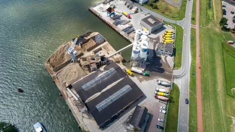 Loading barge with sand and rubble on a small berth. Stock Photos