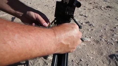 Loading  of belt fed machine gun Stock Footage 41384607