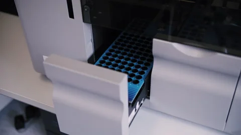 Loading biomaterial into a medical machine for analysis Stock Footage 252955703