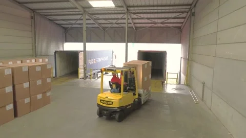 Loading boxes in a container Stock Footage 140810459