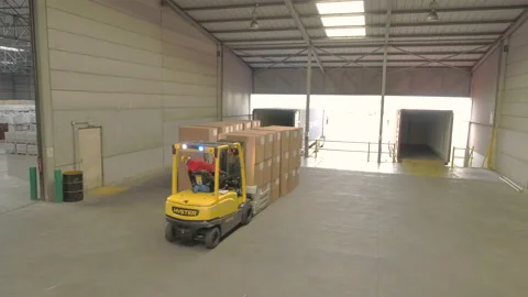 Loading boxes in a container Stock Footage 140811141