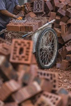 Loading bricks to trolley on the building site Fotos de archivo