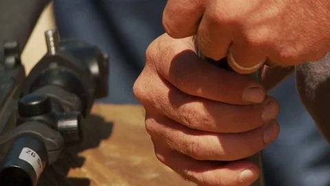 Loading bullets into gun Video stock 78008737