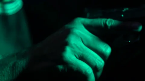 Loading bullets into a gun. Insert catridge into a gun. Stock Footage 146200897