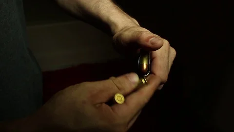 Loading Bullets in Hand Gun Video stock 113076650