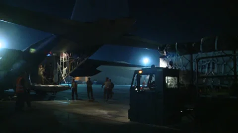 Loading a C-130H Hercules ready for Airdrop Over Afghanistan at Night Stock Footage 33193231