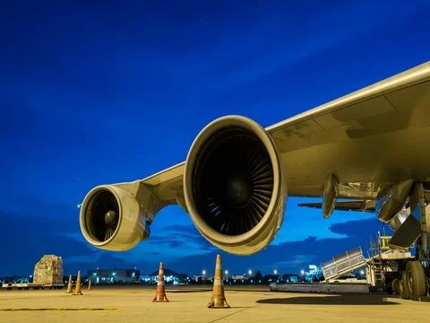 Loading cargo and jet turbine engine at twilight sky Video stock 80609214
