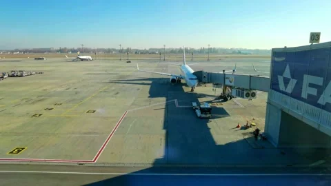 Loading cargo and passengers boarding of plane at Boryspil Airport Stock Footage 194907025