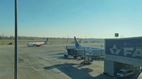 Loading cargo and passengers boarding of plane at Boryspil Airport Stock Footage 194907240