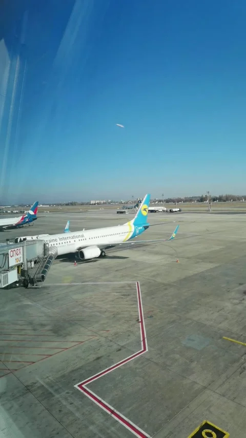Loading cargo and passengers boarding of plane at Boryspil Airport Stock Footage 194907358