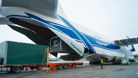 Loading cargo into a cargo plane. Stock Photos