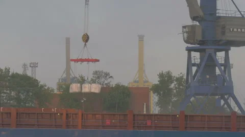 Loading cargo in the port on a cargo ship. Night work at the port Stock Footage 64901300