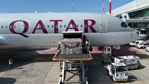 Loading cargo onto a Qatar Airways plane in Rome Stock Footage 316112741