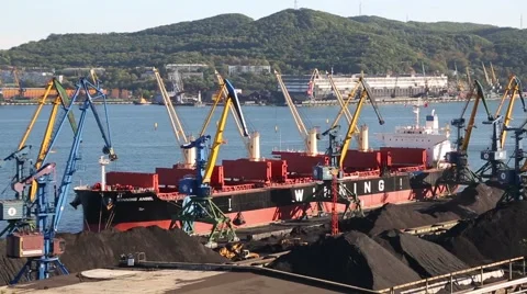 Loading cargo ship coal to the port of Nakhodka. Primorsky Kray, Russia Stock Footage 56664491