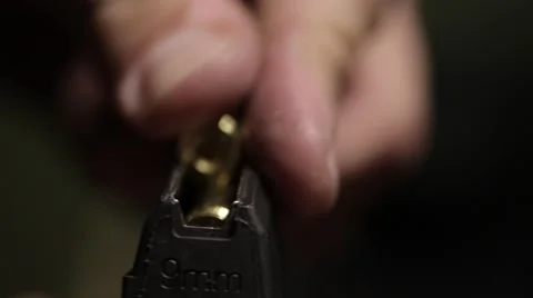Loading cartridge with 9mm bullets Stock Footage 61570884
