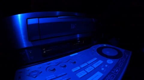 Loading a cassette into video recorder Stock Footage 49699905