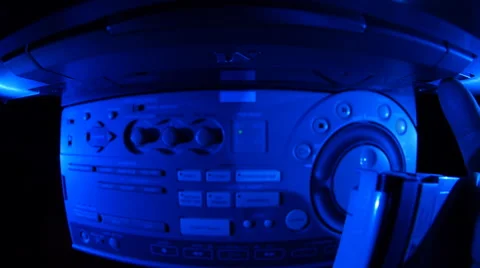 Loading a cassette into video recorder Video stock 49700296