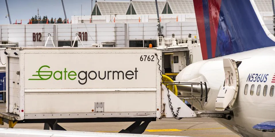 Loading catering supplies into a plane Stock Photos