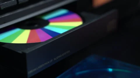 Loading CD with Rainbow Colors and Starting Music Playback in Compact Disc Stock Footage 323249775