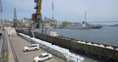 Loading cement from cars on the pier. Видео 89953656