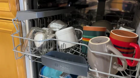 Loading Ceramic Mugs and Glassware into a Bosch Dishwasher Upper Rack Stock Footage 329447250
