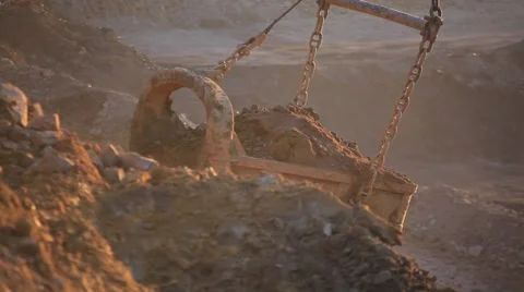 Loading coal into heavy dump truck at the opencast mining at sunset Stock Footage 61851070