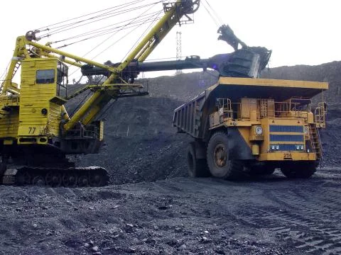 Loading coal into a mining dump truck. Yakutia. Russia Stock Photos