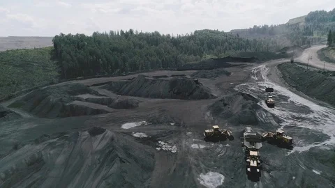 Loading coal on a quarry overlooking the forest aerial video Video stock 114833743
