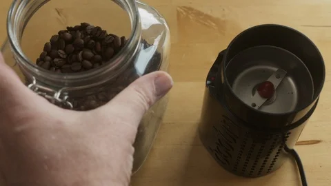 Loading coffee beans into grinder Stock Footage 127437291