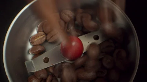 Loading coffee beans into grinder Stock Footage 139395809
