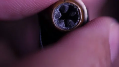 Loading Colt 1911 gun magazine with hollow point bullets, macro frontal shot Stock Footage 154568375