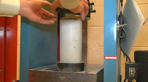 Loading a Concrete Cylinder in a Compression Machine Stock Footage 43630798