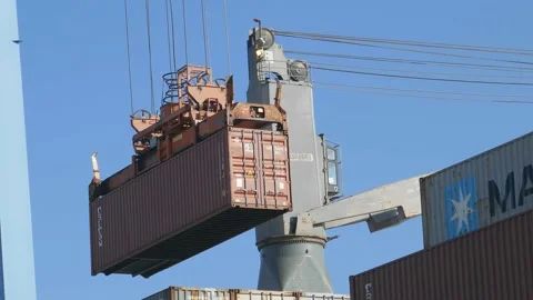 Loading container to ship by industrial line gantry crane 4k creative business Stock Footage 164774128
