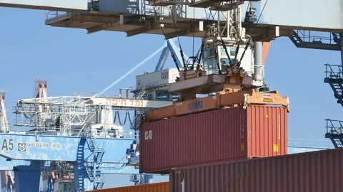 Loading container to ship by industrial line gantry crane 4k creative business Stock Footage 164775099