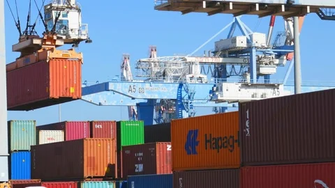 Loading container to ship by industrial line gantry crane 4k creative business Stock Footage 164777278