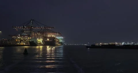 Loading containers on a cargo ships at night Stock Footage 337856792