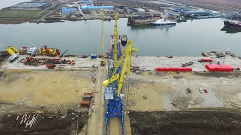 Loading cranes on a barge, Temryuk Commercial Sea Port, Russia, aerial view Stock Footage 122697121