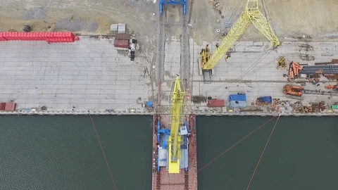 Loading cranes on a barge, Temryuk Commercial Sea Port, Russia, aerial view Stock Footage 122697485
