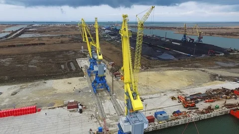 Loading cranes on a barge, Temryuk Commercial Sea Port, Russia, aerial view Stock Footage 122697734