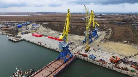 Loading cranes on a barge, Temryuk Commercial Sea Port, Russia, aerial view Stock Footage 122697756