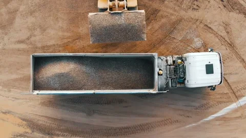 Loading crushed stone into a dump truck, aerial top view Video stock 237265094